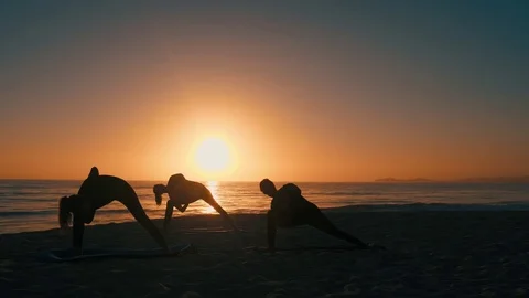 Group Of Women Practicing Yoga Vídeo Stock 77585478