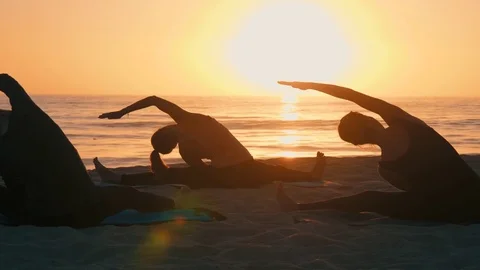 Group Of Women Practicing Yoga Stock Footage 78717057