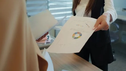 Group of womens hands exchanging papers preparing for meeting. Stock Footage 296577450
