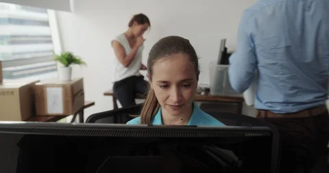 A group of work colleagues moving into a new office together Stock Footage 100567892