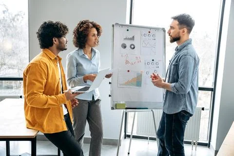 Group work concept. Successful creative colleagues are working together on a new Stock Photos
