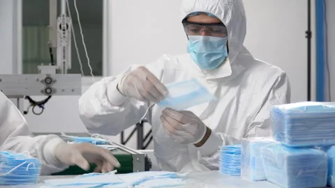 Group of worker in ppe suit inspecting quality control and counting surgica.. Stock Footage 246119453