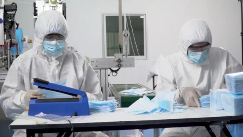 Group of worker in ppe suit inspecting quality control and counting surgica.. Stock Footage 246119507