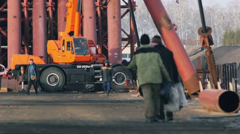 Group of Workers Against Ironwork and Crane Stock-Footage 37163171