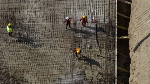 Group of workers check quality of pouring concrete at construction site 스톡 동영상 236473966