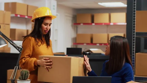Group of workers checking merchandise in packages Stock Footage 236431088