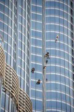 Group of workers cleaning windows Stock Photos