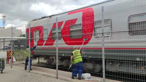 Group of workers cleans passenger train car Stock Footage 230956403