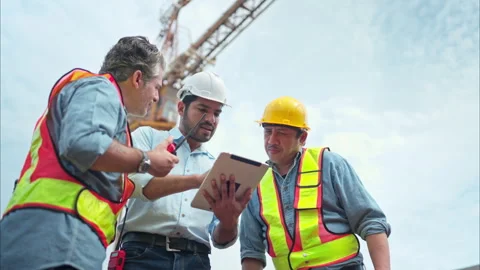 Group of workers at construction site are discussing construction progress Stock Footage 291848922