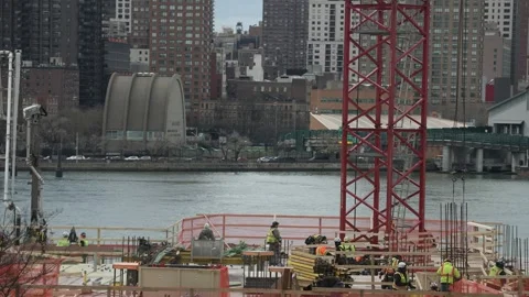 Group of workers on a construction site in megapolis Stock Footage 241451355