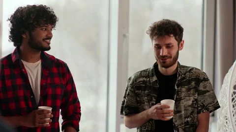 A group of workers drink coffee and talk to each other during their lunch Stock Footage 243366481