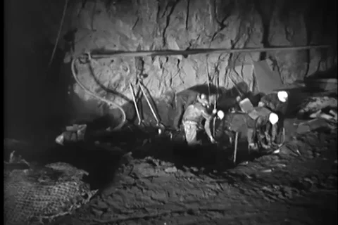 Group of workers fix dynamites and explode the mountainous areas - 1950 Stock Footage 99082323