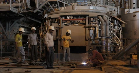Group Of Workers Looking At Metal Welding (4K) Stock Footage 60766980