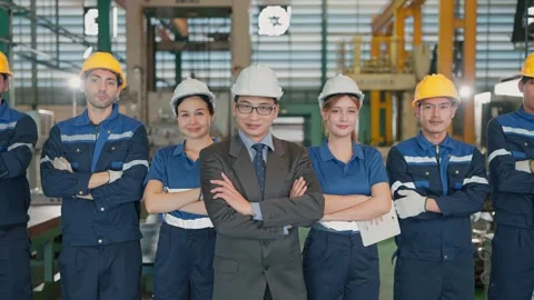 Group workers stand confidently in a factory Stock Footage 341925053