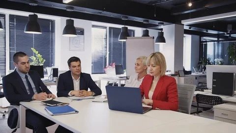 Group of workers talking about new business project in office Stock Footage 119411077