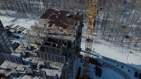 A Group Of Workers On Top Of A Building Under Construction Stock Footage 150426090