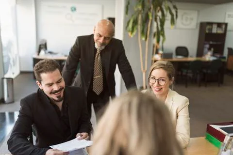 Group of workers un office looking papers Stock-Fotos