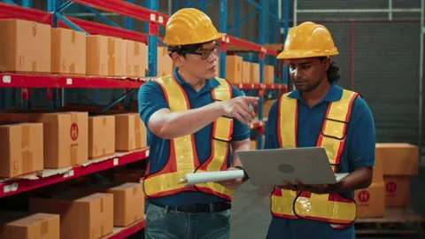 Group of  workers wearing helmet checking inventory and discussing in modern  動画素材 204918141