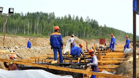 A group of working people and builders perform installation work Stock Footage 73819619