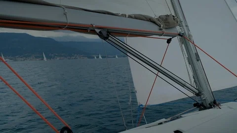 Group of  yacht Sailing regatta in the wind through the waves Stock Footage 109420341