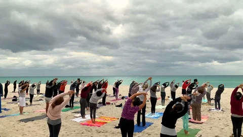  Group Yoga Class on the Sand Beach at Sunset Stock Footage 102629146