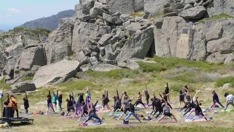 Group Yoga at the mountainside 스톡 동영상 73488272