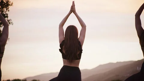 Group yoga session at park Stock Footage 130052265