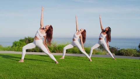 Group yoga session at park with view on an ocean Stock Footage 130043836