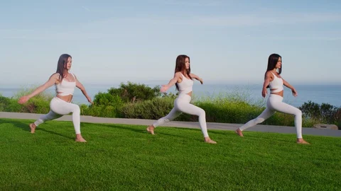 Group yoga session at park with view on an ocean Stock Footage 130043842