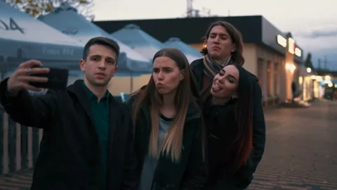 A group of young active friends makes a cool selfie on the street under the Video stock 114555692