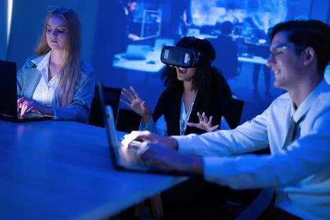 Group of young adults engaged in virtual reality experience at tech worksho.. Stock Photos