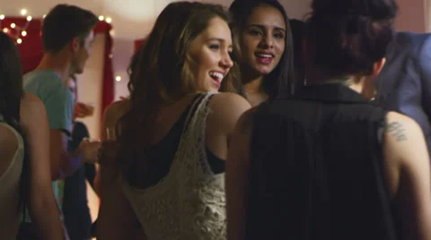 A group of young adults have fun dancing together at a house party Stock Footage 34015915