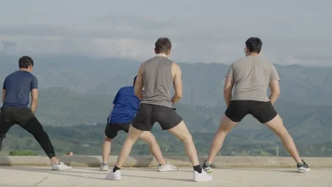 Group of young adults stretching and warming up in sportswear. Stock Footage 281582725