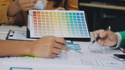 Group of young application developers analyzing uxui mobile app templates d.. Stock Footage 316828100