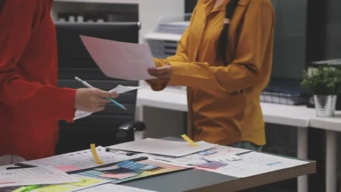 Group of young application developers analyzing uxui mobile app templates d.. Stock Footage 320526698