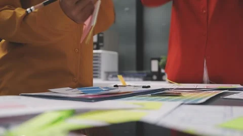 Group of young application developers analyzing uxui mobile app templates d.. Stock Footage 320526878