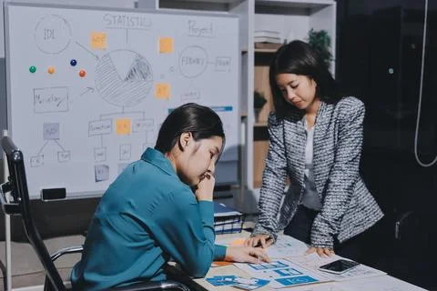 Group of young application developers analyzing uxui mobile app templates d.. Stock Photos