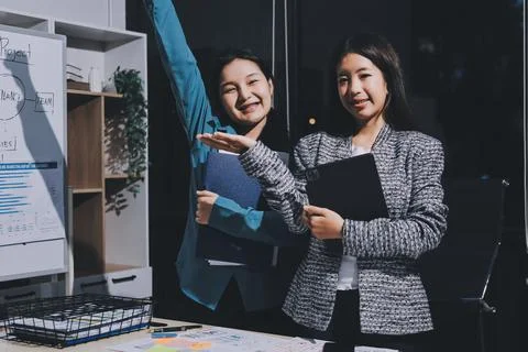 Group of young application developers analyzing uxui mobile app templates d.. Stock Photos