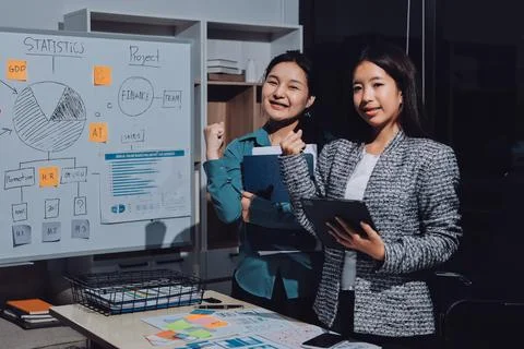 Group of young application developers analyzing uxui mobile app templates d.. Stock Photos
