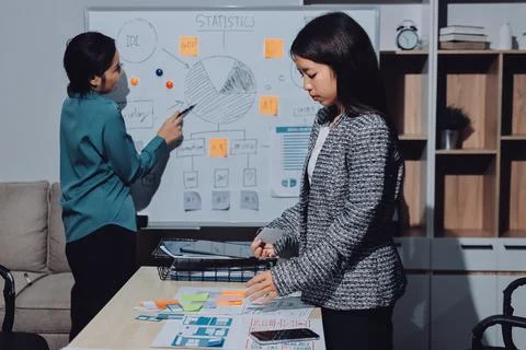 Group of young application developers analyzing uxui mobile app templates d.. Stock Photos