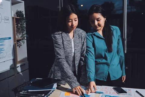 Group of young application developers analyzing uxui mobile app templates d.. Stock Photos