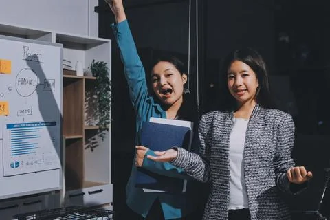 Group of young application developers analyzing uxui mobile app templates d.. Stock Photos