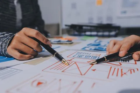Group of young application developers analyzing uxui mobile app templates d.. Foto stock