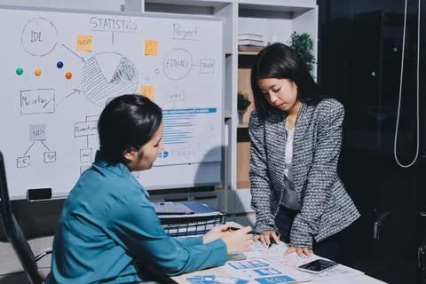 Group of young application developers analyzing uxui mobile app templates d.. Stock Photos