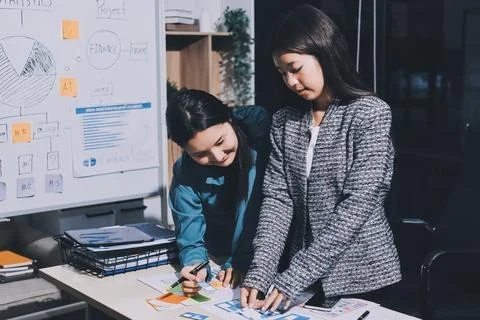 Group of young application developers analyzing uxui mobile app templates d.. Stock Photos