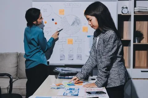 Group of young application developers analyzing uxui mobile app templates d.. Foto stock
