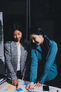 Group of young application developers analyzing uxui mobile app templates d.. Stock Photos