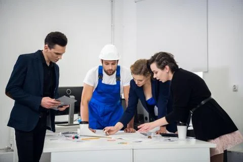 A group of young architects working on a project Stock Photos