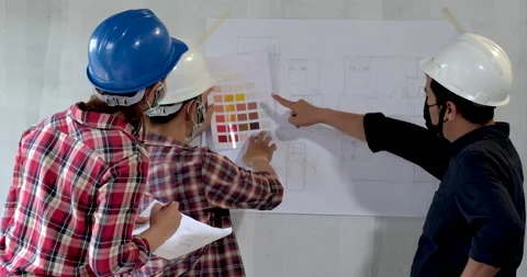 Group of young asian of engineer chooses the perfect color for a new house Stock Footage 146679313