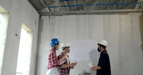 Group of young asian of engineer chooses the perfect color for a new house Video stock 146679528